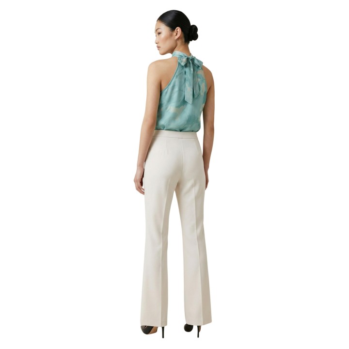 Pantalón palazzo Artigli de mujer en color crema vista posterior de tres cuartos