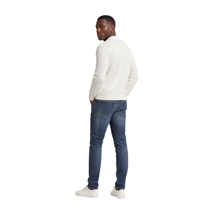 Tommy Hilfiger Jeans vaqueros Scanton Slim de hombre en denim azul vista posterior de tres cuartos