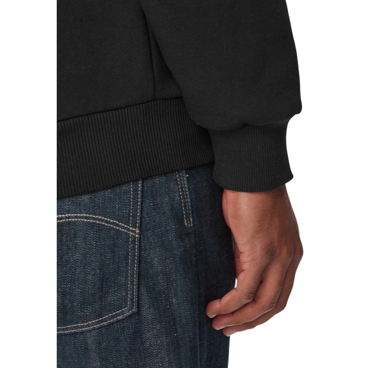 Detalle del puño y bajo de sudadera Lacoste negra SH8868