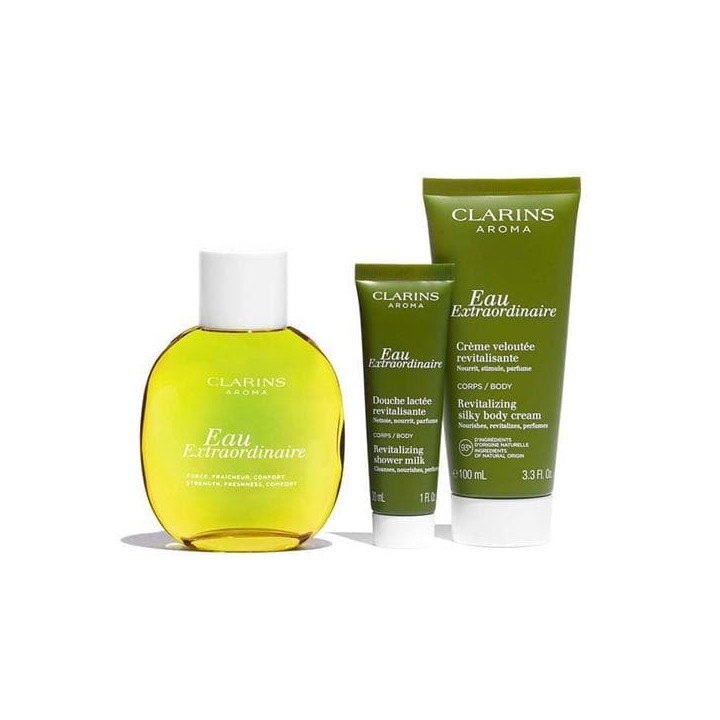 Lote Eau Extraordinaire Clarins para mujer: perfume amarillo y cremas verdes vista frontal