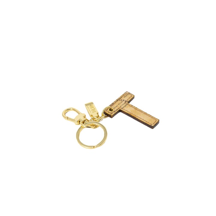 Alviero Martini Prima Classe llavero de mujer beige en cuero letra T vista de tres cuartos