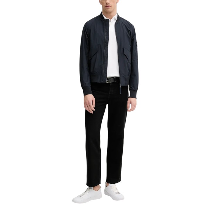 Tommy Hilfiger polo de hombre blanco de manga larga vista frontal bajo chaqueta