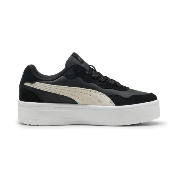 Zapatillas Puma para mujer negras con franja beige y suela plataforma blanca vista lateral