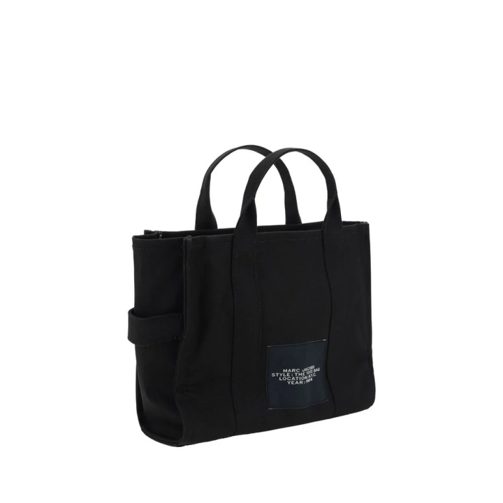 Bolso Marc Jacobs The Tote Bag negro con lettering blanco dorsal