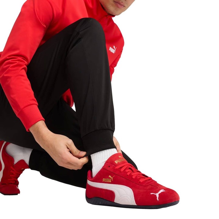 Chándal Puma Essentials de poliéster chaqueta y pantalón rojo negro detalle inferior